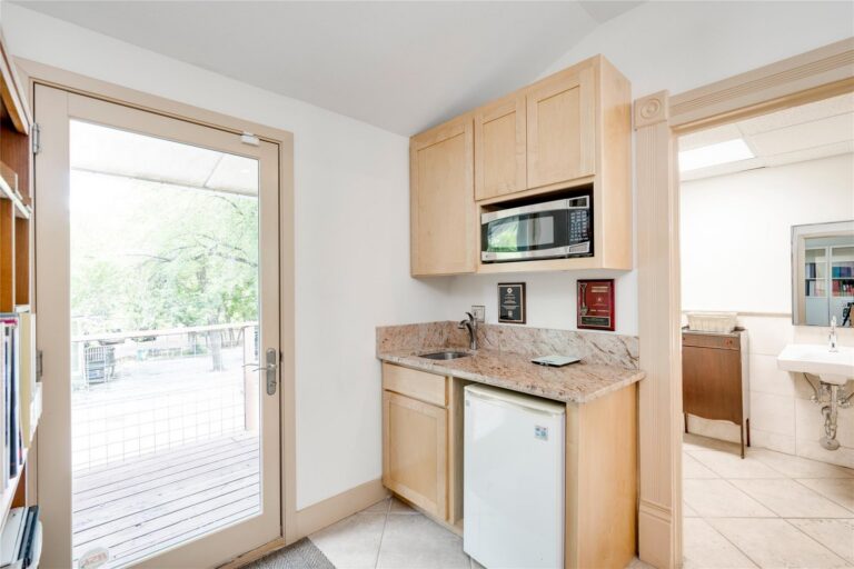 Kitchenette and rear door at 1102 West Avenue, Suite 100, Austin, TX 78701
