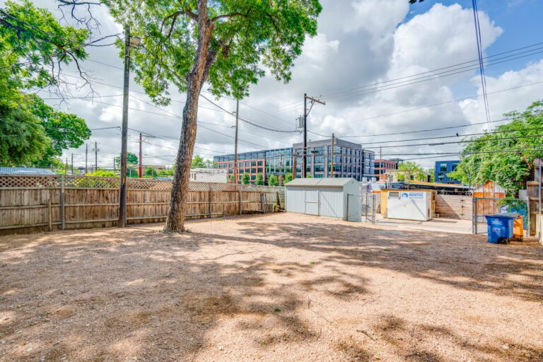 Rear yard view toward the neighborhood at 1309 E 7th St, Austin, TX 78702