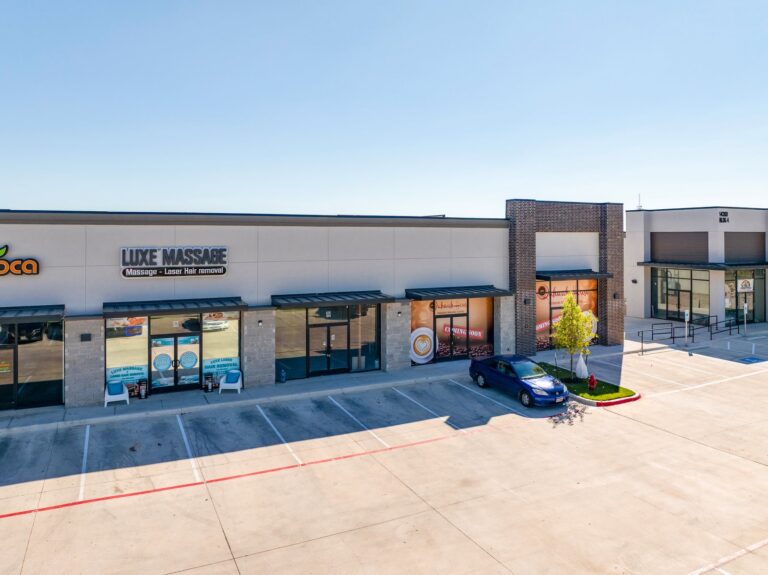 Retail-center storefronts and surface parking at 14300 Ronald Reagan Blvd, Suite 304, Leander, TX 78641