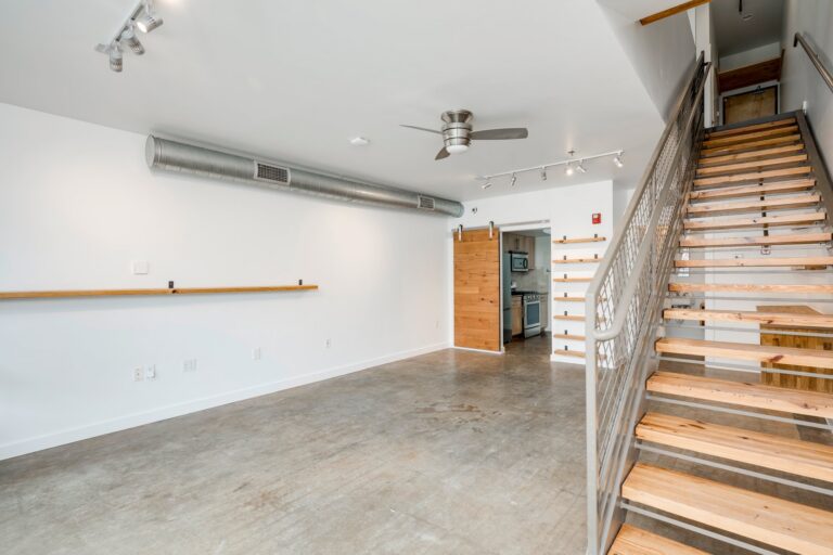 Ground-floor workspace and stairs at 1601 E Cesar Chavez St, Unit 104, Austin, TX 78702