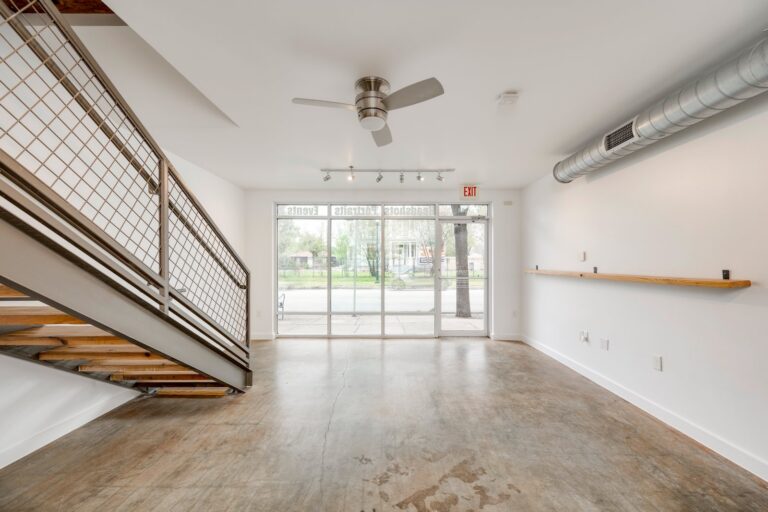 Interior view of the staircase and storefront at 1601 E Cesar Chavez St, Unit 104, Austin, TX 78702