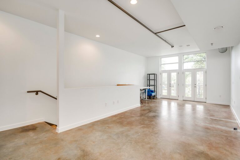 Upper-level workspace and stair landing at 1601 E Cesar Chavez St, Unit 104, Austin, TX 78702