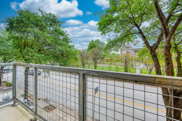 Upper-level exterior balcony view at 1601 E Cesar Chavez St, Unit 104, Austin, TX 78702