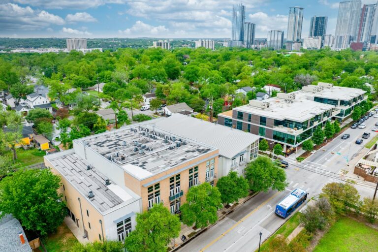 Aerial view of Waterstreet Lofts and the neighborhood at 1601 E Cesar Chavez St, Unit 104, Austin, TX 78702